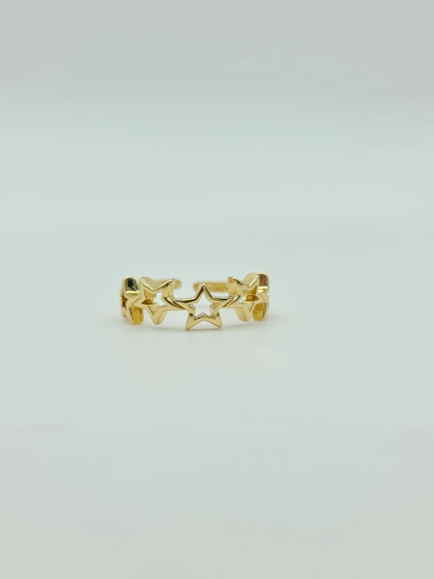 Anillo de estrellas dorado
