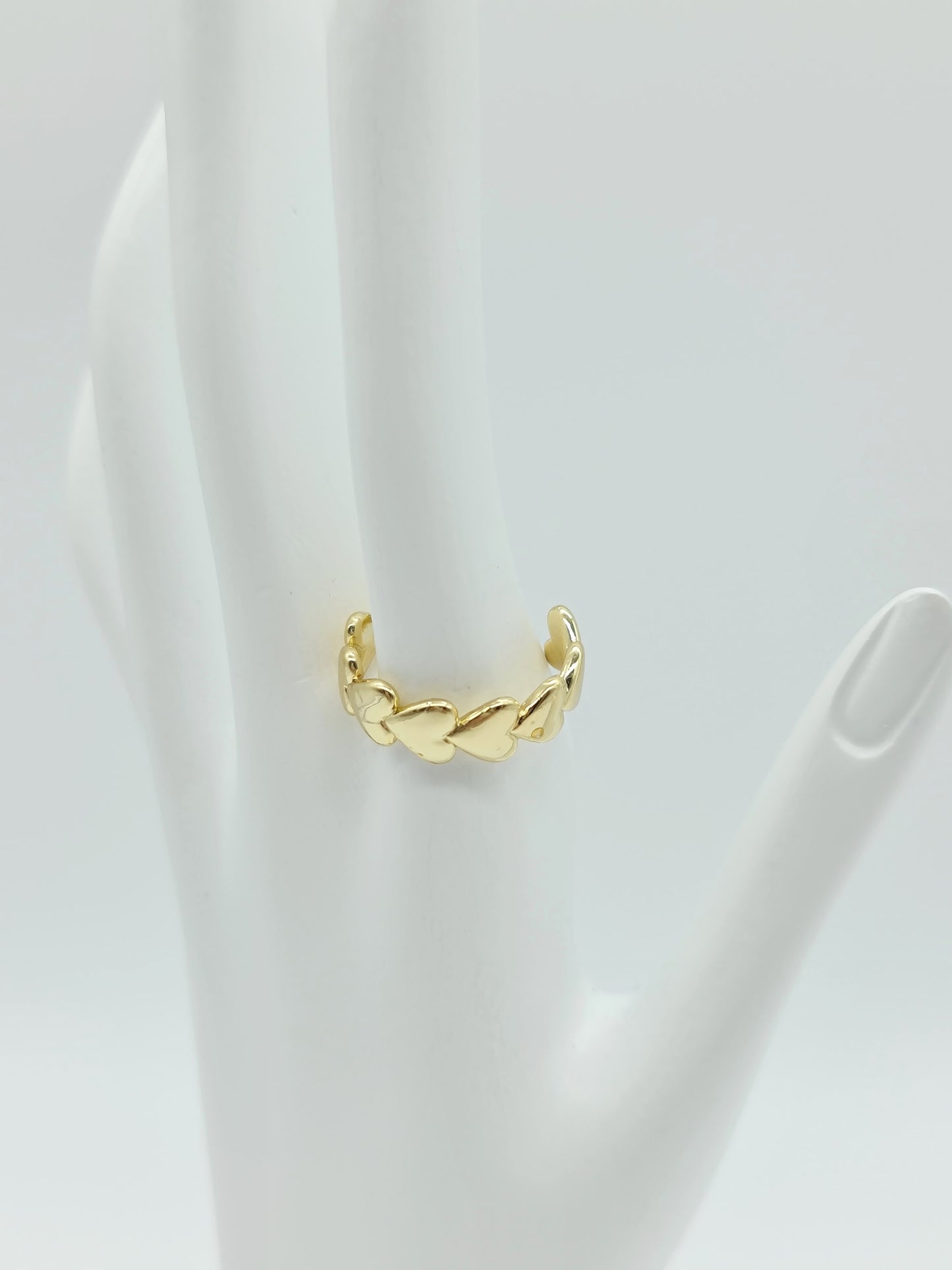 Anillo abrazo de corazón dorado