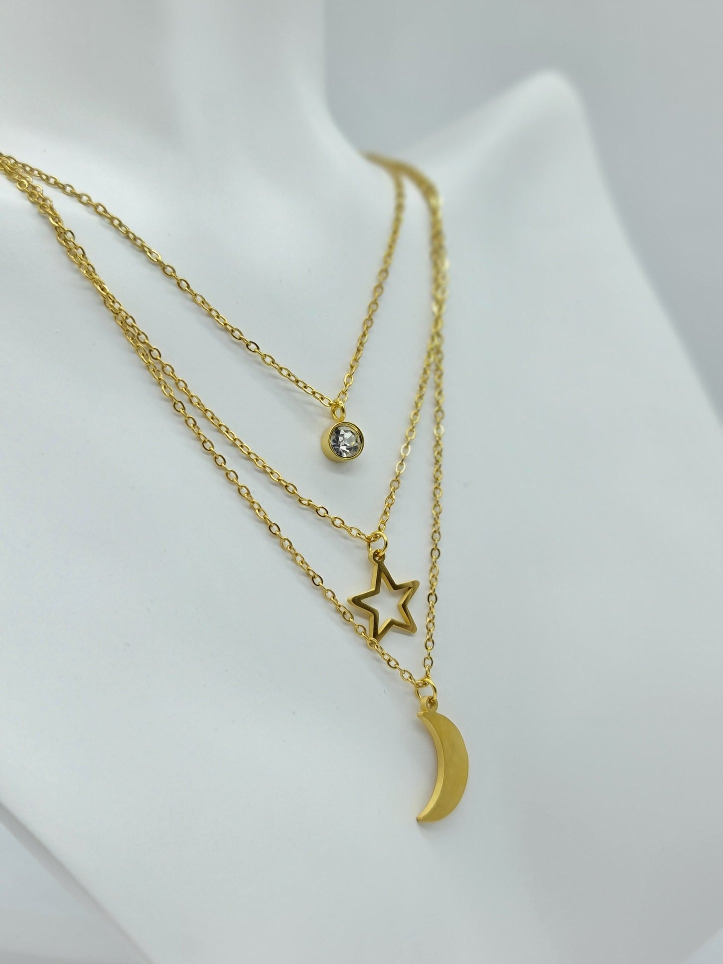 Juego de collar y aretes triple Luna y cristal