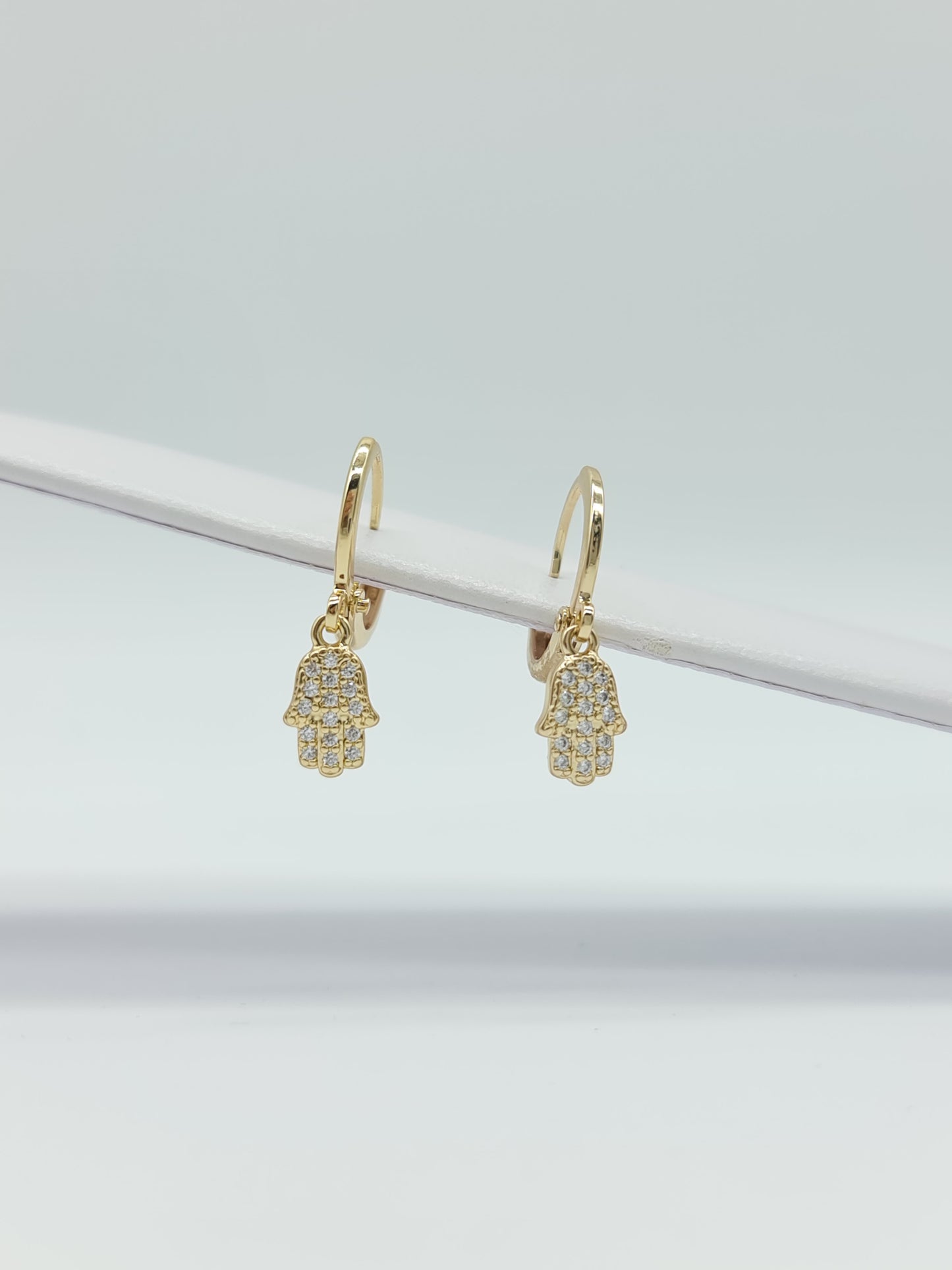 Huggie oro en figuras y cristal