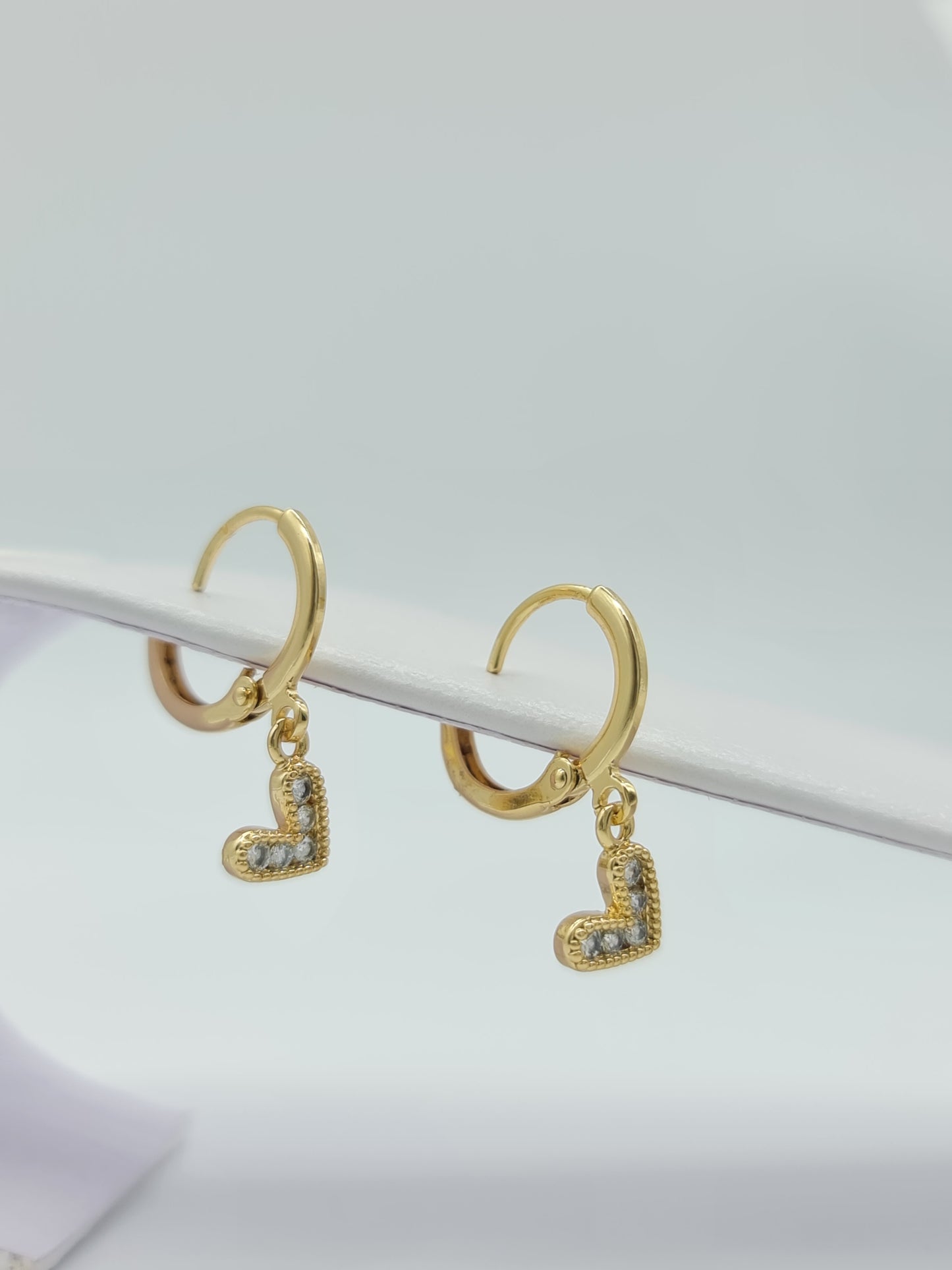 Huggie oro en figuras y cristal