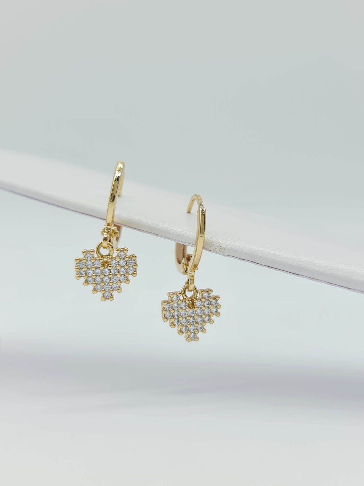 Huggie oro en figuras y cristal