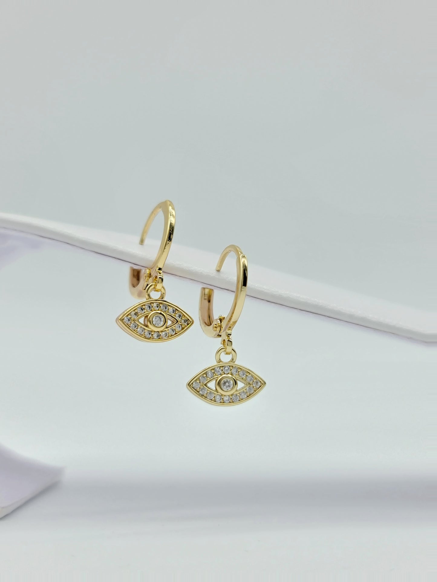 Huggie oro en figuras y cristal